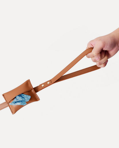 Close-up of the brown waterproof leather dog leash, highlighting the waste bag holder.