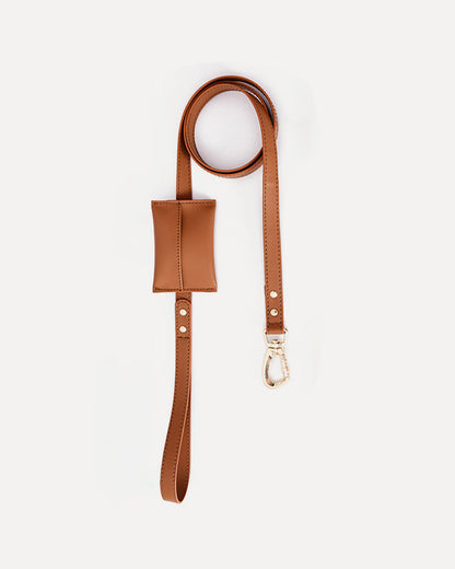 Overview of the waterproof leather dog leash with bag holder in brown, featuring its complete design.